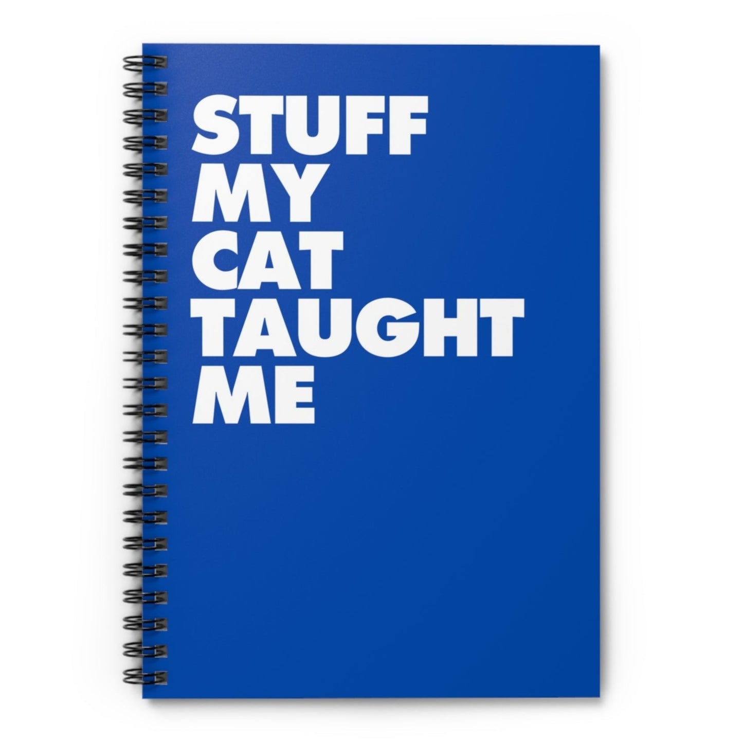 Blank spiral notebook with the phrase 'Stuff My Cat Taught Me' on a bold blue background.
